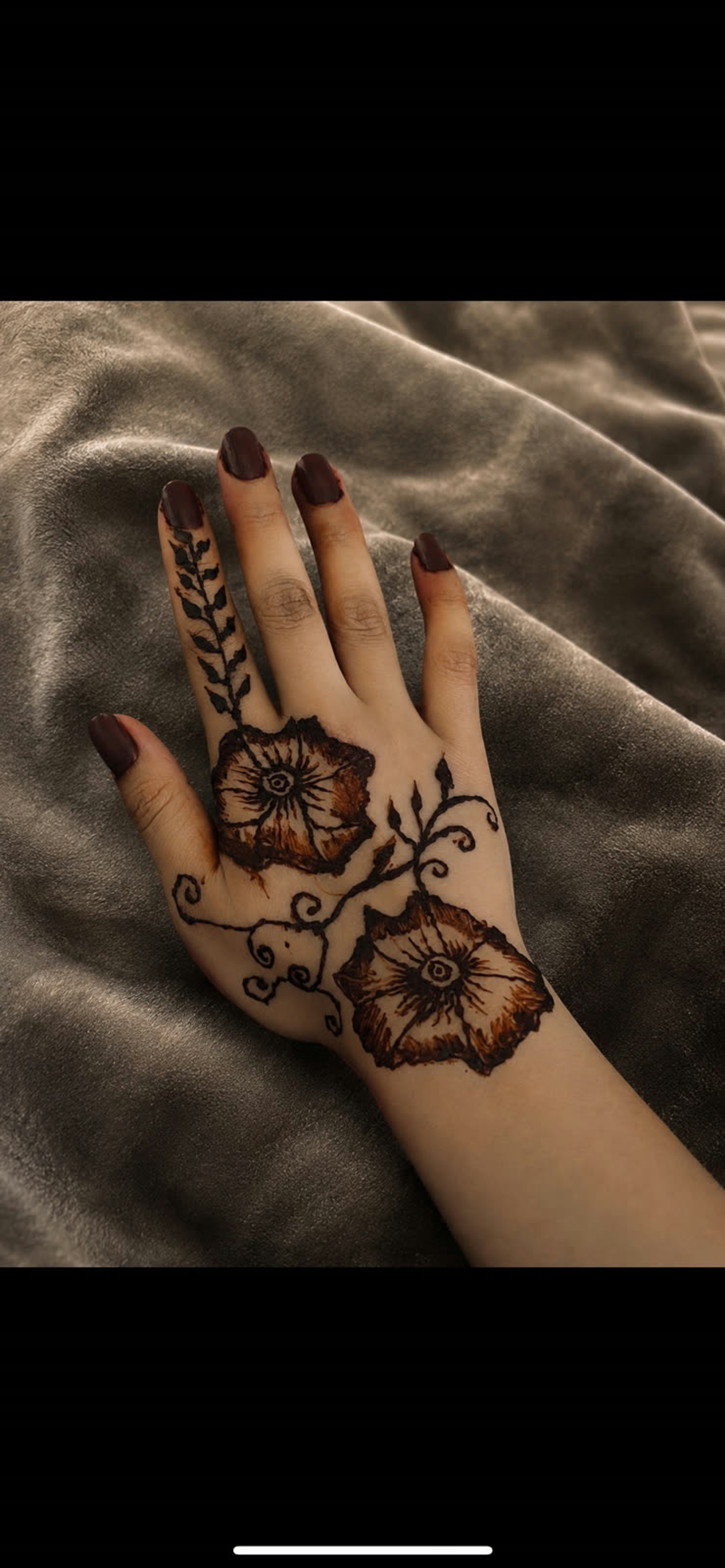 Detailed henna design on the hand