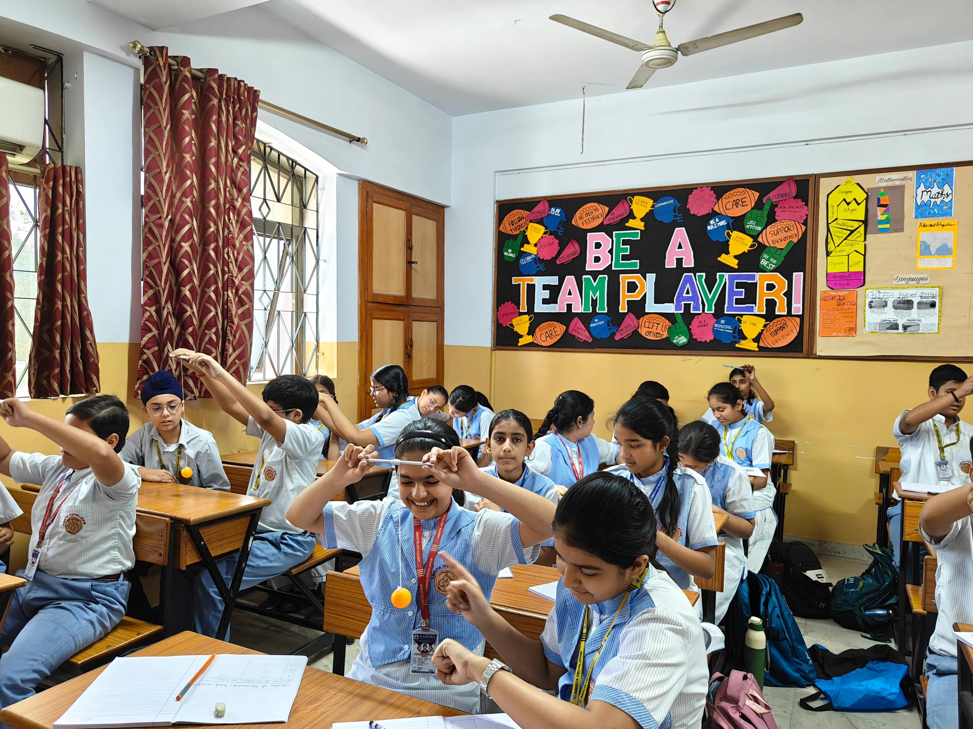 Grade7: Pendulum at Desk Science Activity photo