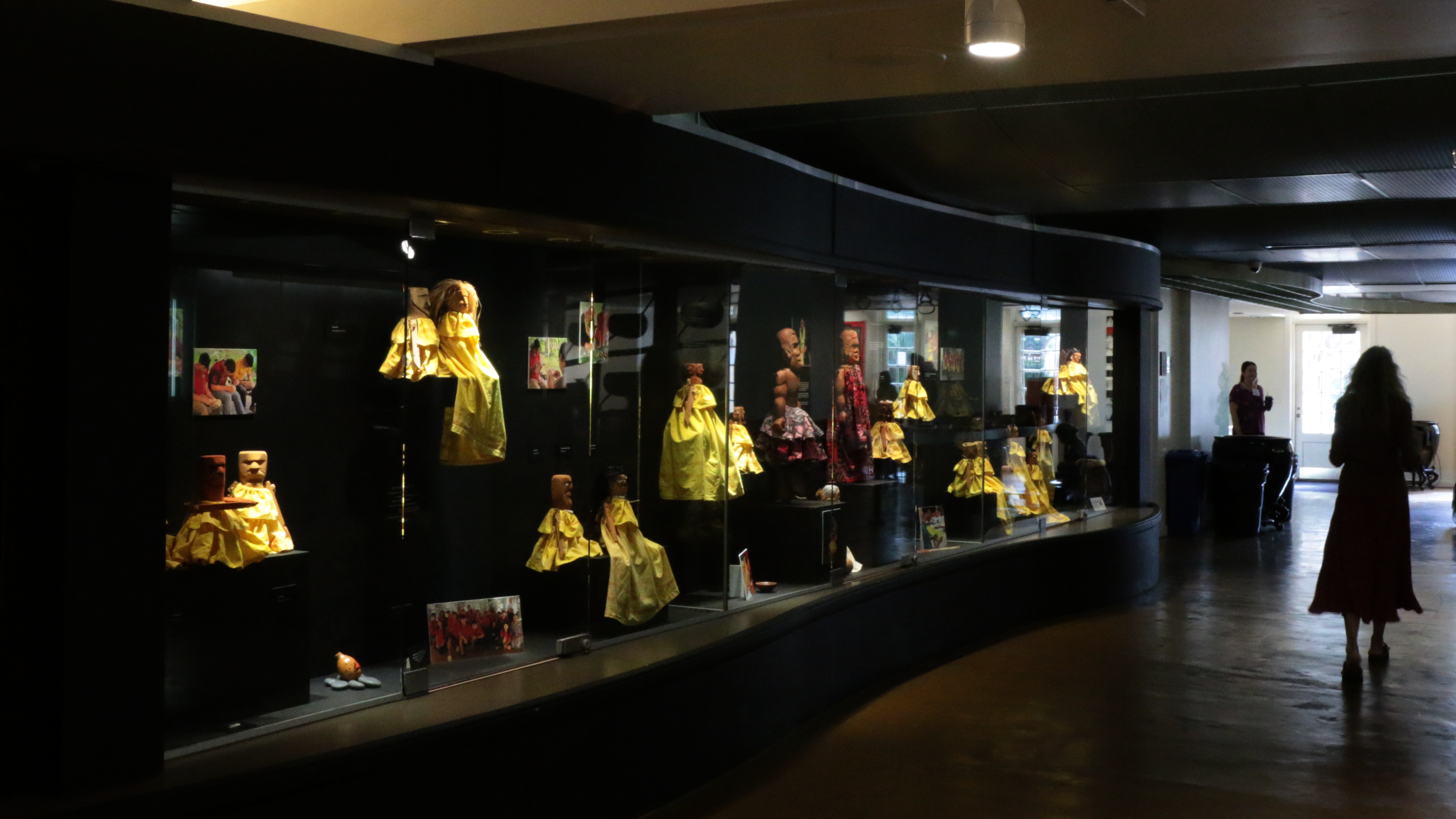 Two people observe artwork in a gallery