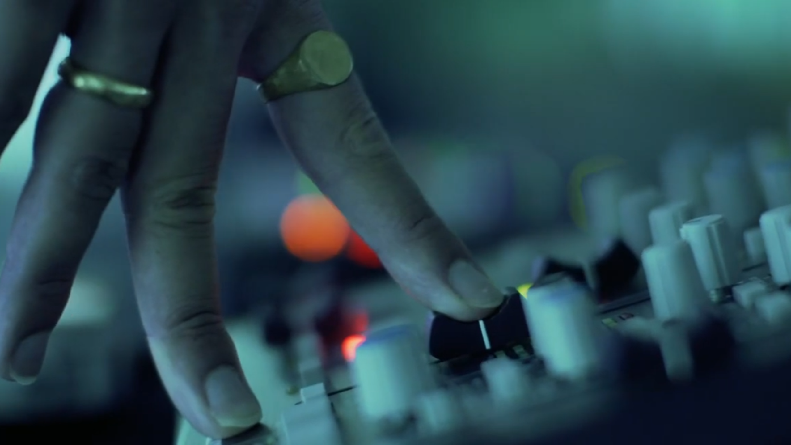 persons hand on a sound board