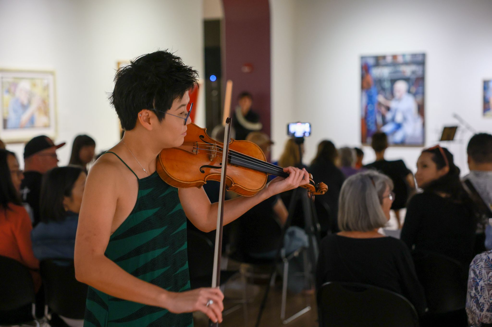 Violinist in museum gallery