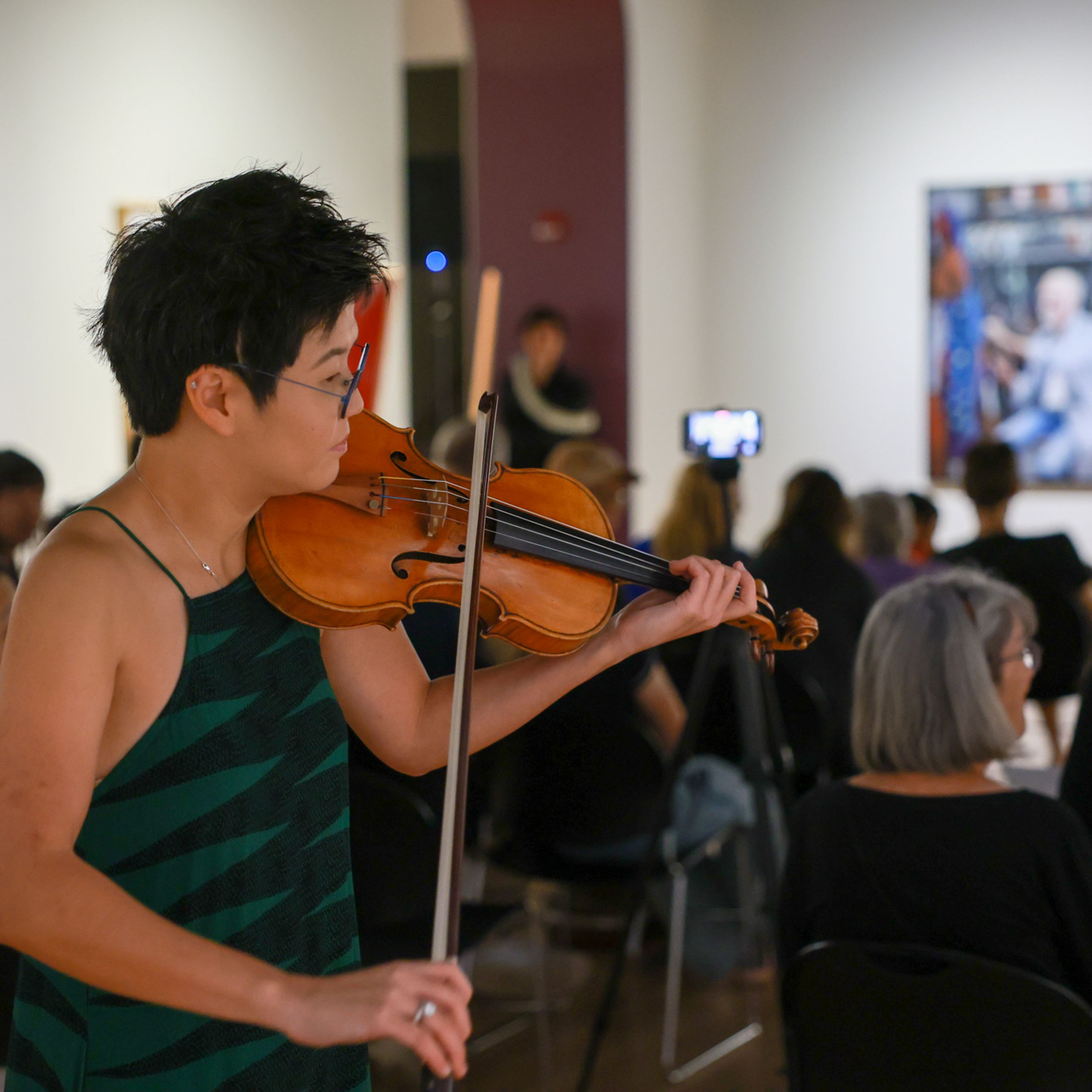 Violinist in museum gallery