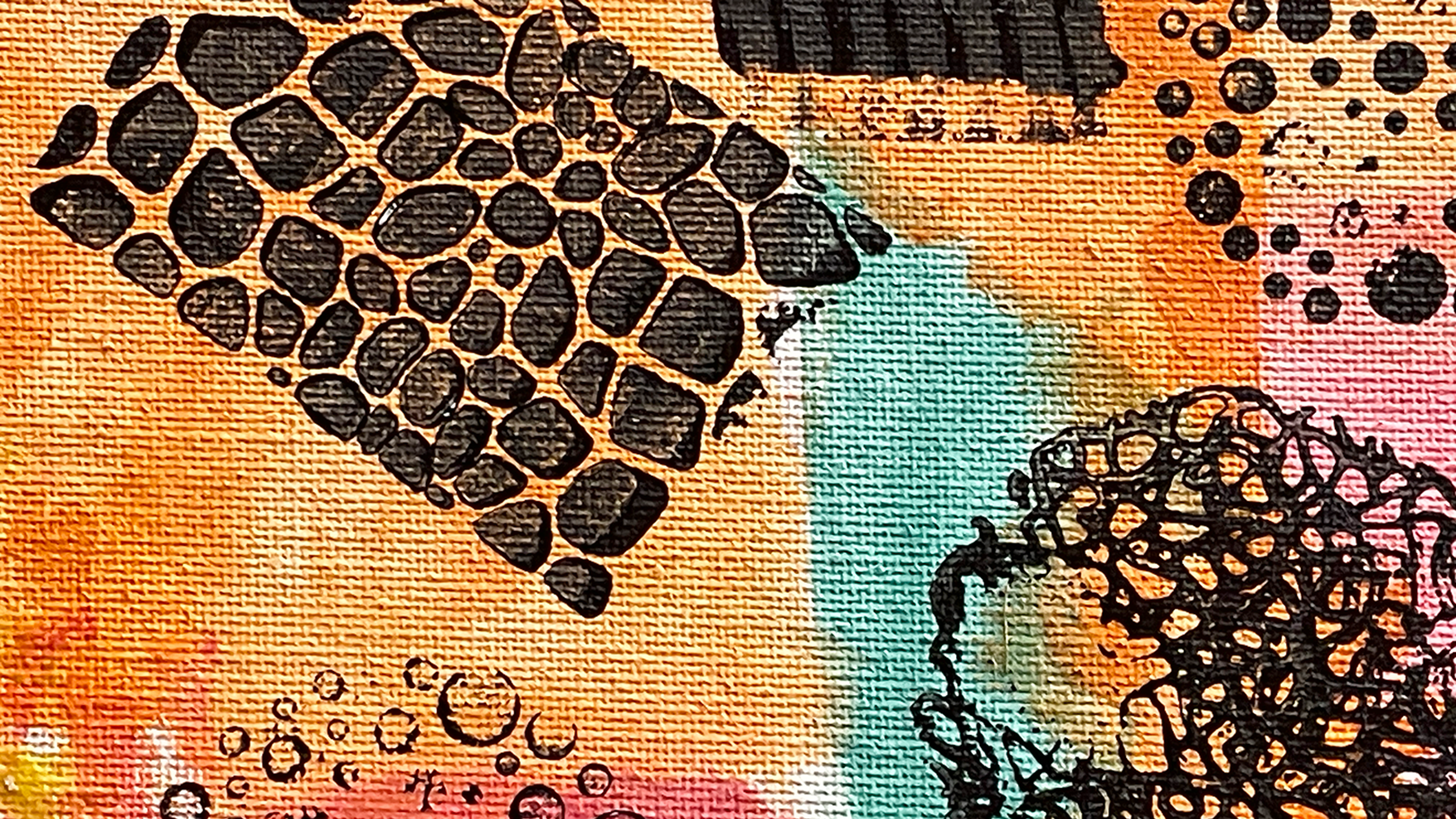 Detail from a painting done with splashes of watercolor in shades of orange, pink, turquoise, and red with patterns stamped over it in black.