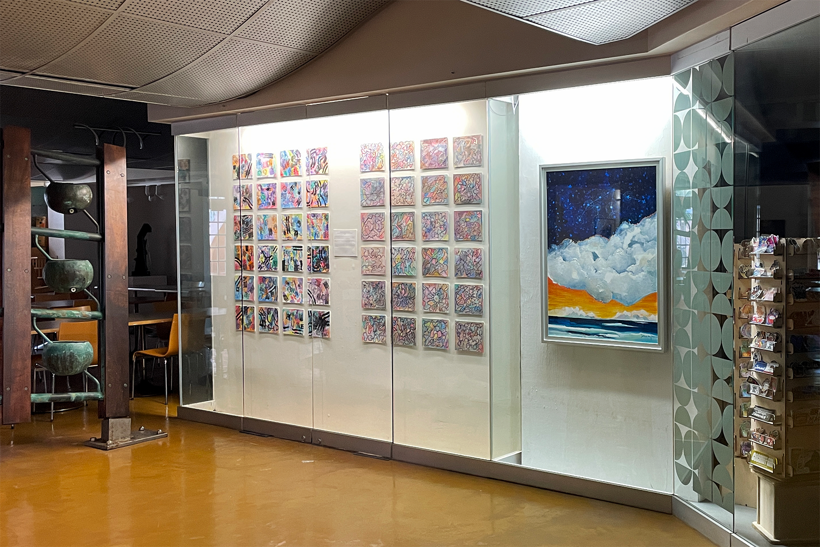 View of the mini-exhibit in a glass wall case, between the gift shop and cafe. 