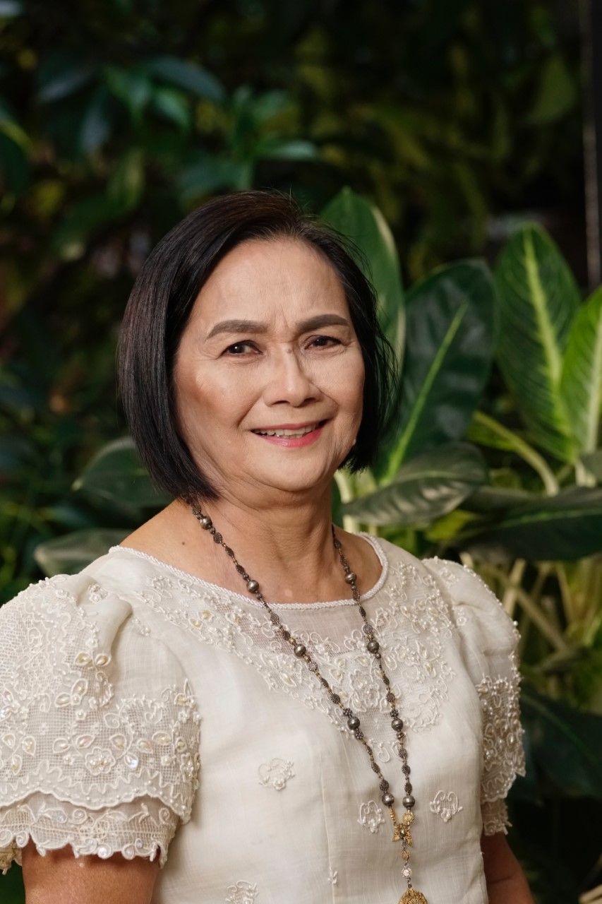 Clara Lapus wearing a white dress.
