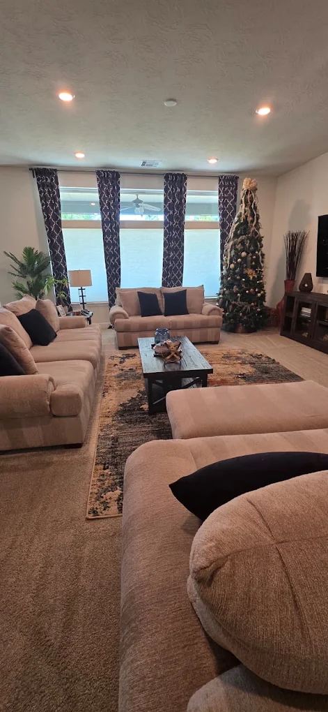 Sofa and living room surfaces dusted and tidy