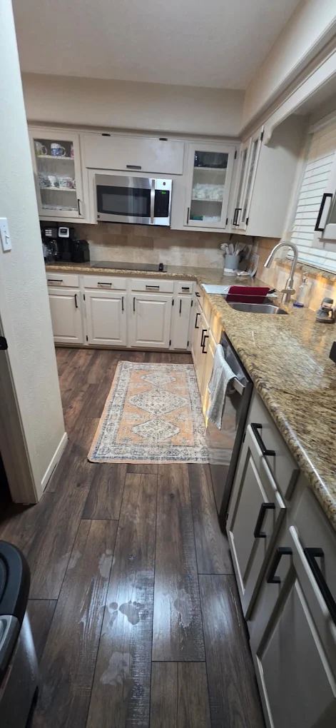 Kitchen hardwood floors polished to a shine