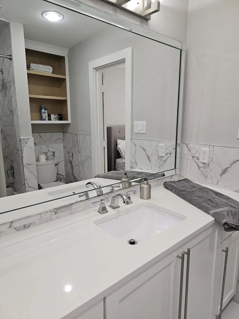 Bathroom vanity and mirror cleaned to a spotless shine