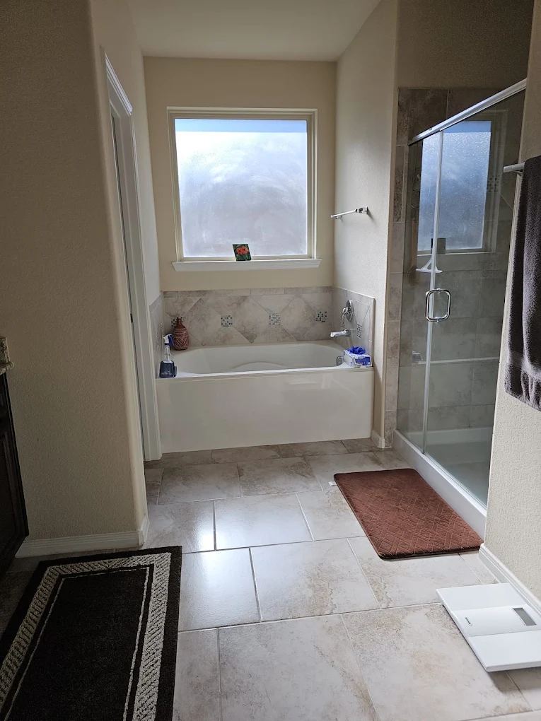 Tub and shower surround scrubbed and rinsed clean