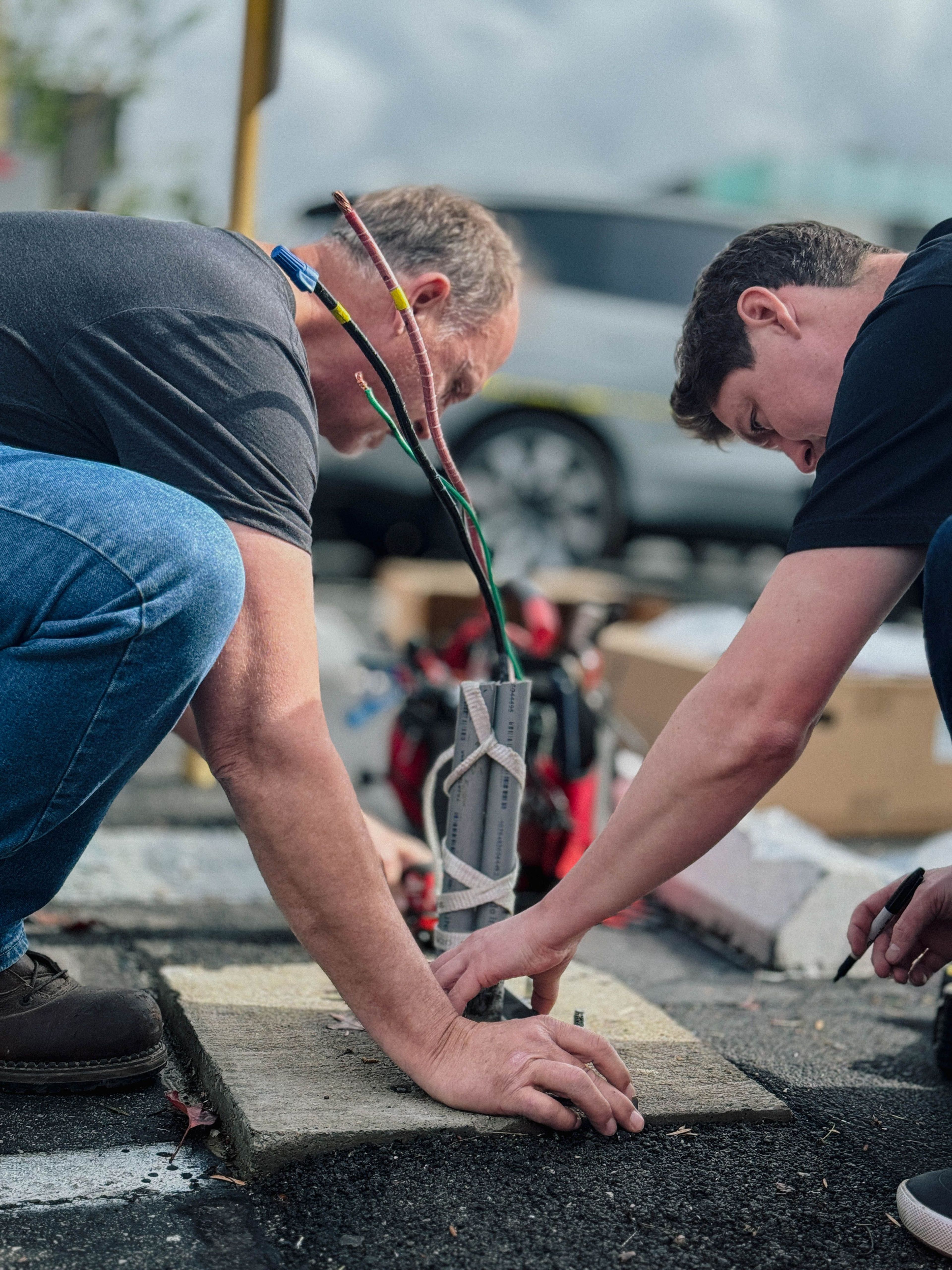 2 men installing Xeal Charger