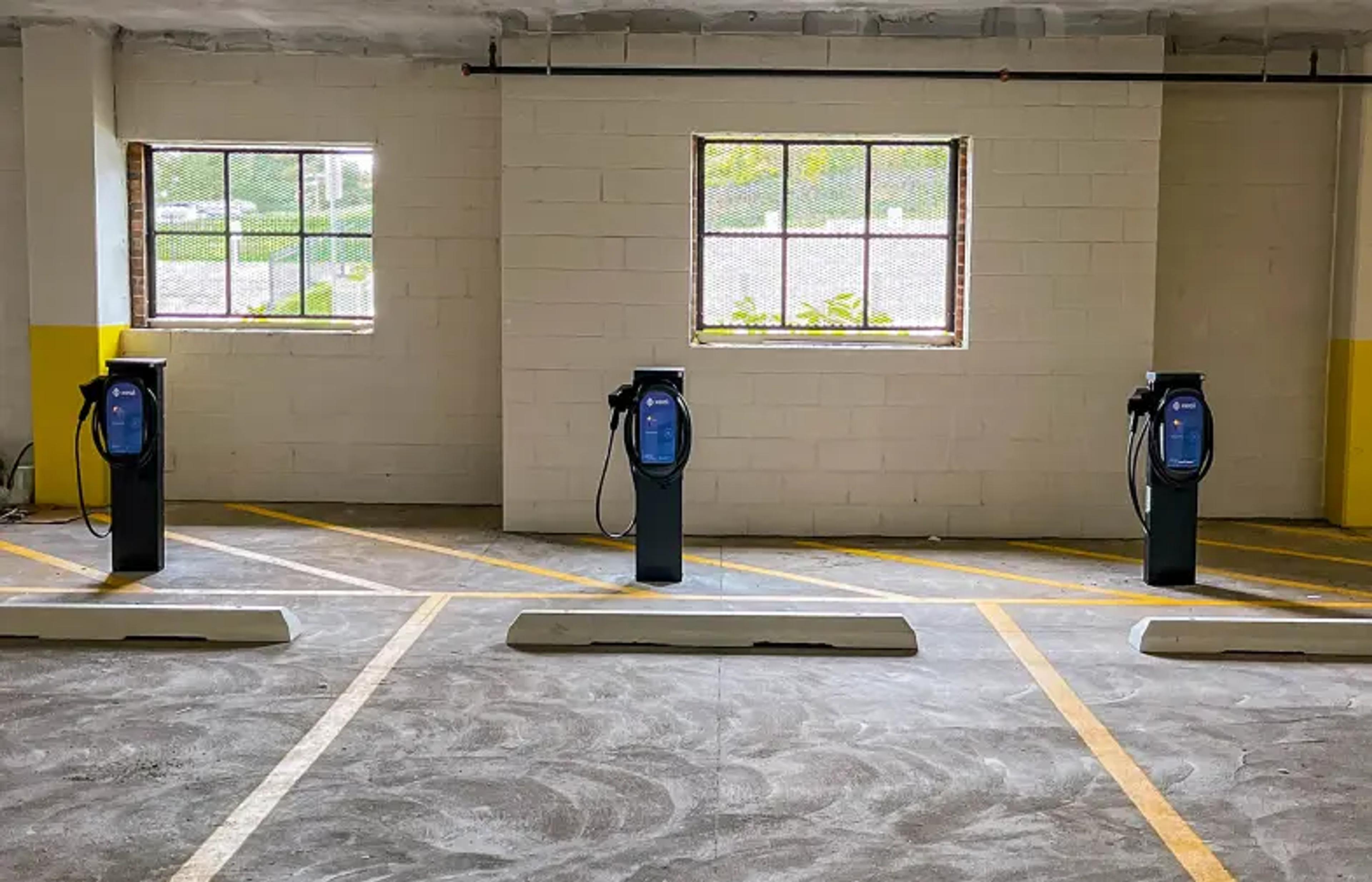 a row of charging stations in a parking garage