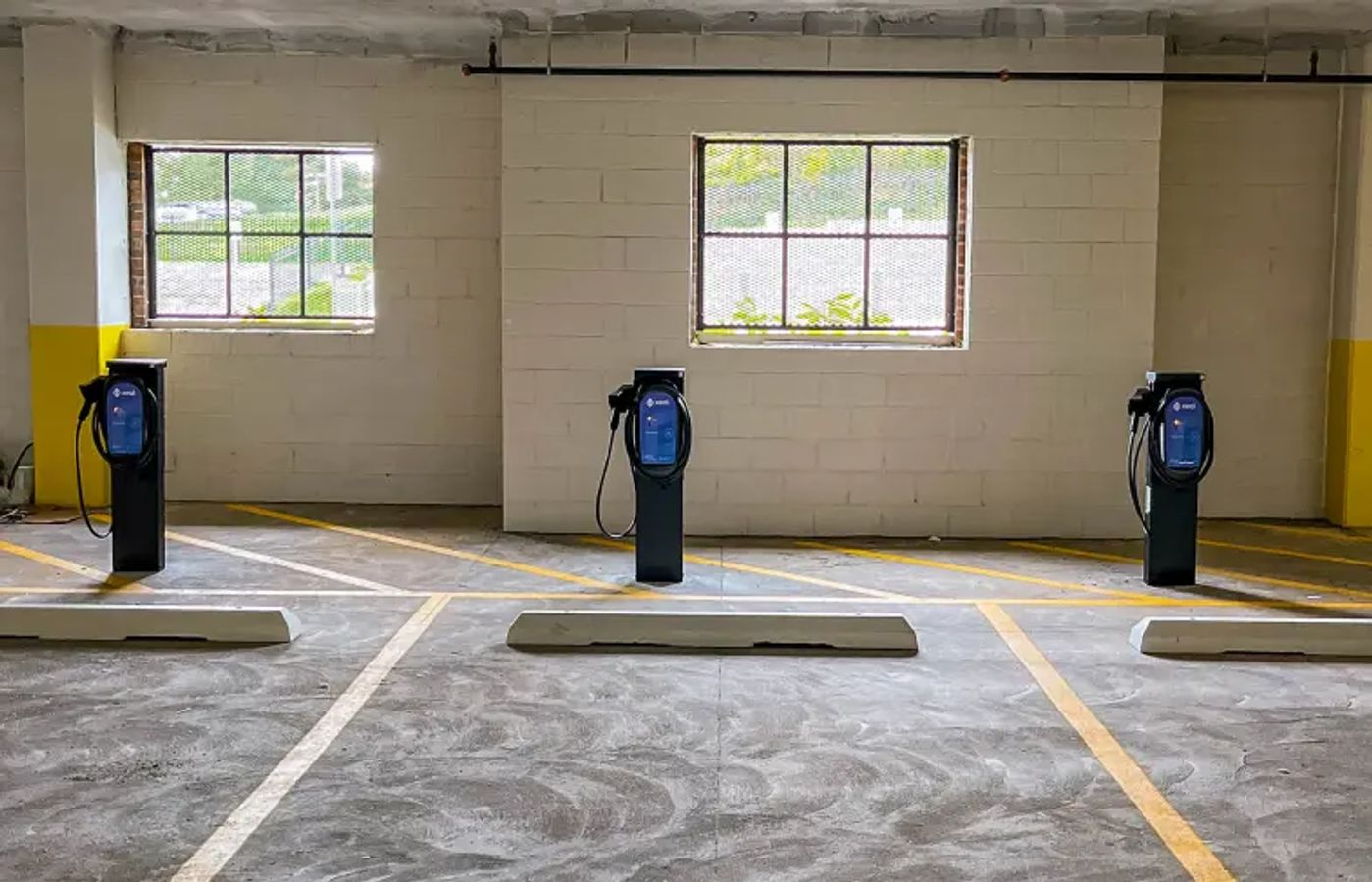 a row of charging stations in a parking garage