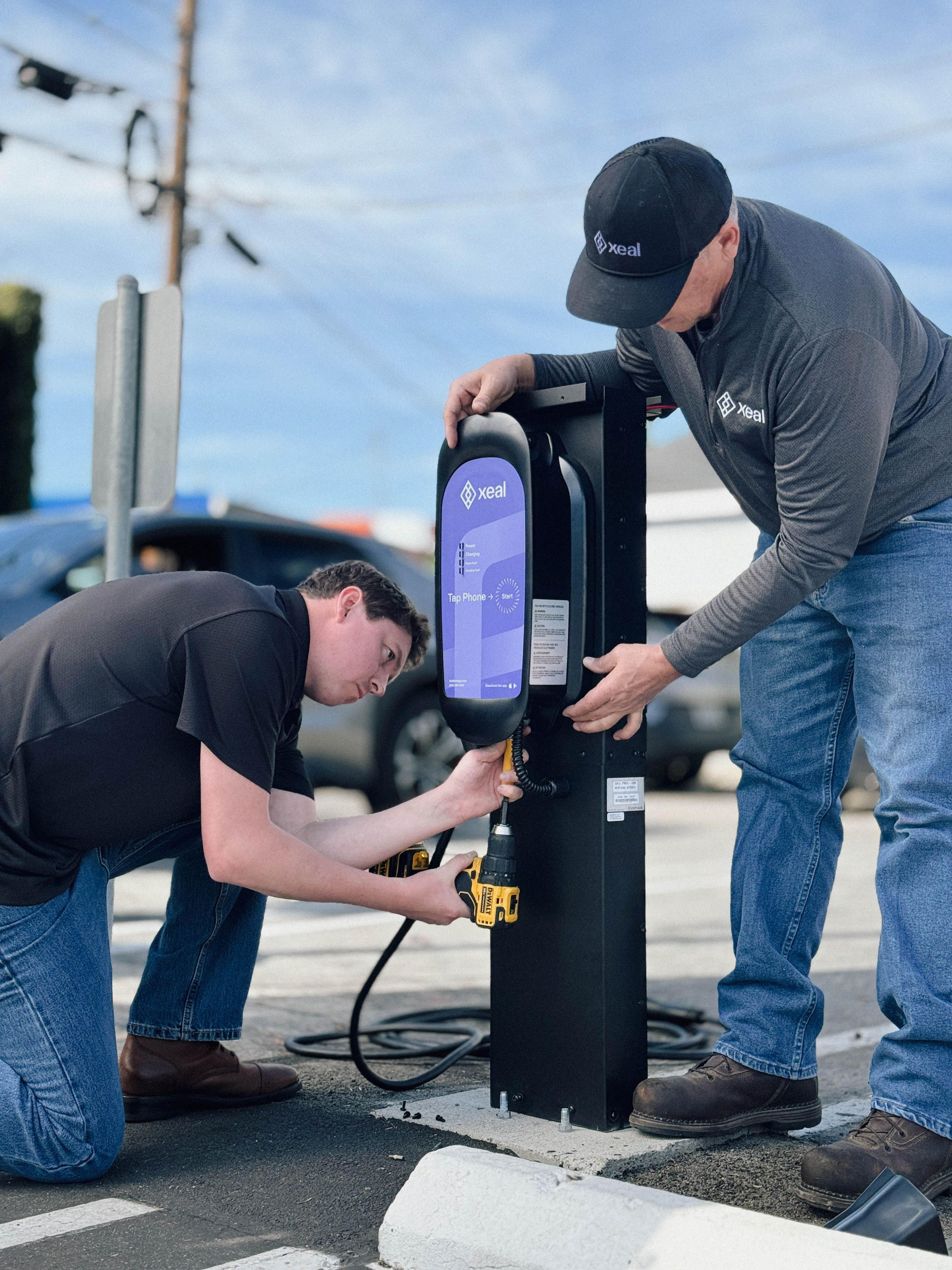 2 men installing Xeal Charger