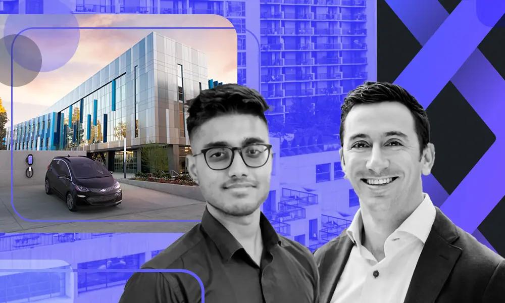 two men are standing next to each other in front of a building .