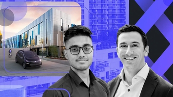 two men are standing next to each other in front of a building .