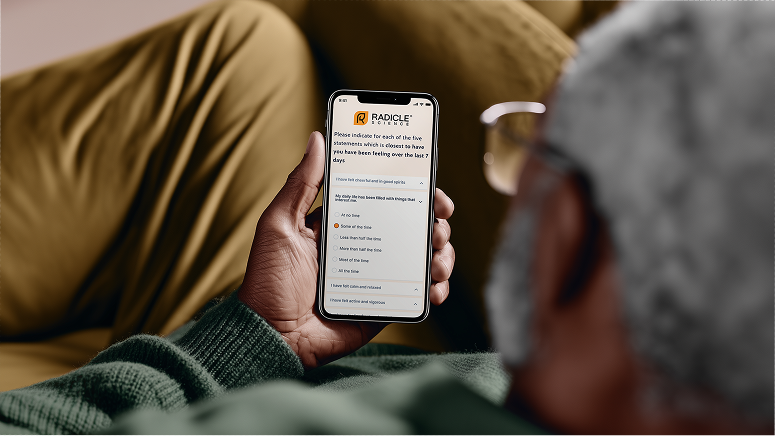 Man_looking_at_mobile_device_with_PROs_web