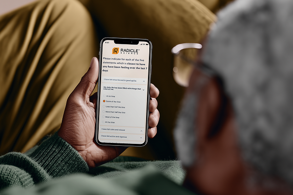Man_looking_at_mobile_device_with_PROs_web