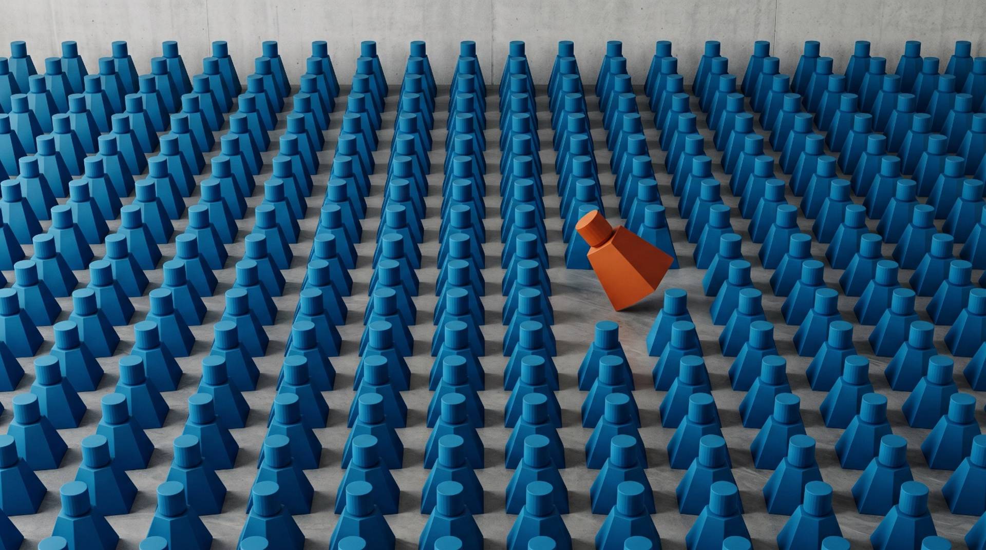 Identical moulded forms in tight rows under flat light, with one different form breaking the pattern.