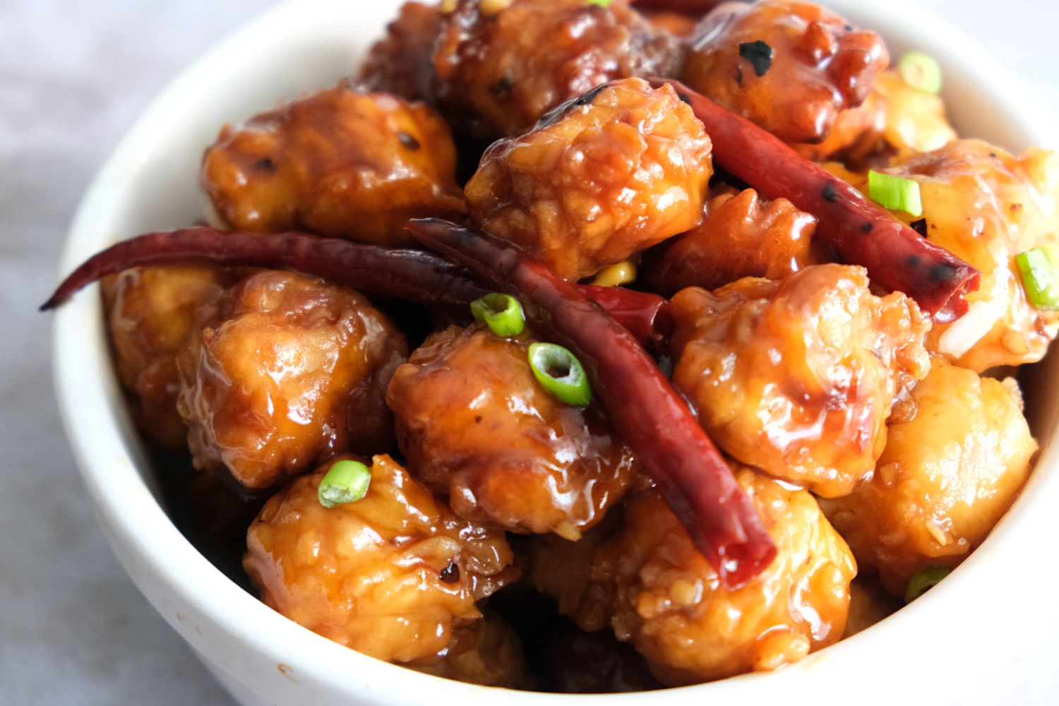 General Tso's Tofu with green onions and red chiles