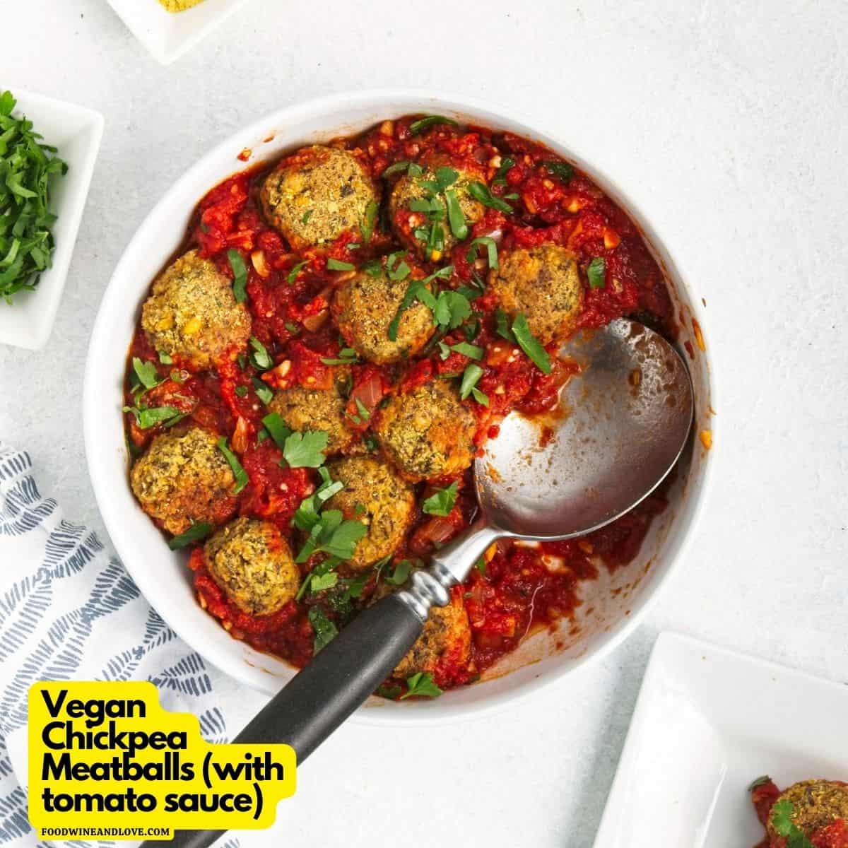 Vegan chickpea meatballs with tomato sauce in a bowl with a serving spoon.