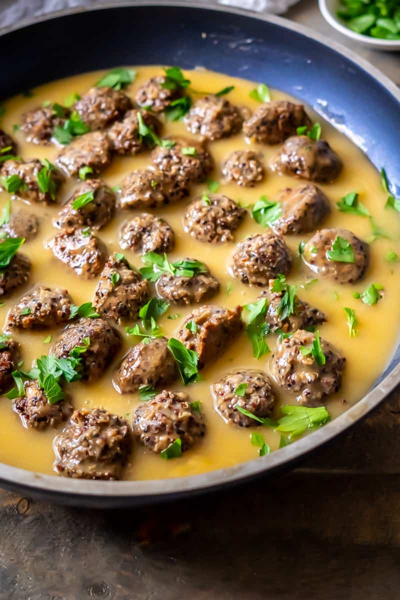 Gluten-free vegan Swedish meatballs and gravy in a pan. 