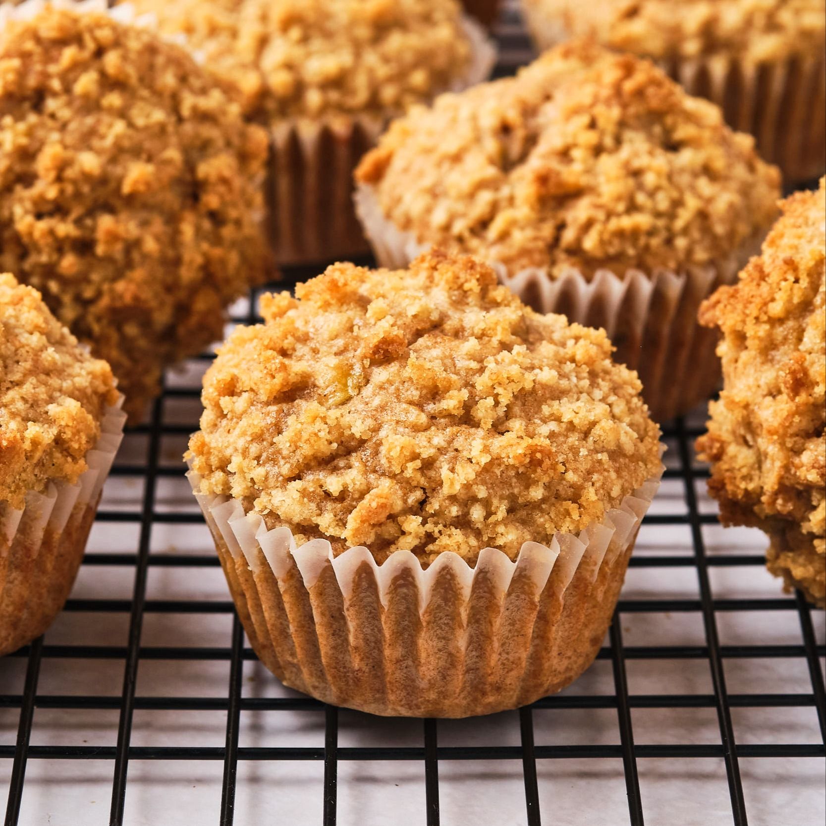 Vegan banana muffins on a cooling rack.