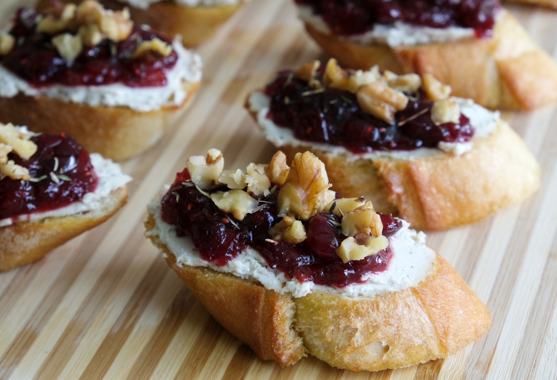 Walnuts make a good choice of topping for these cranberry and cashew cheese crostini.