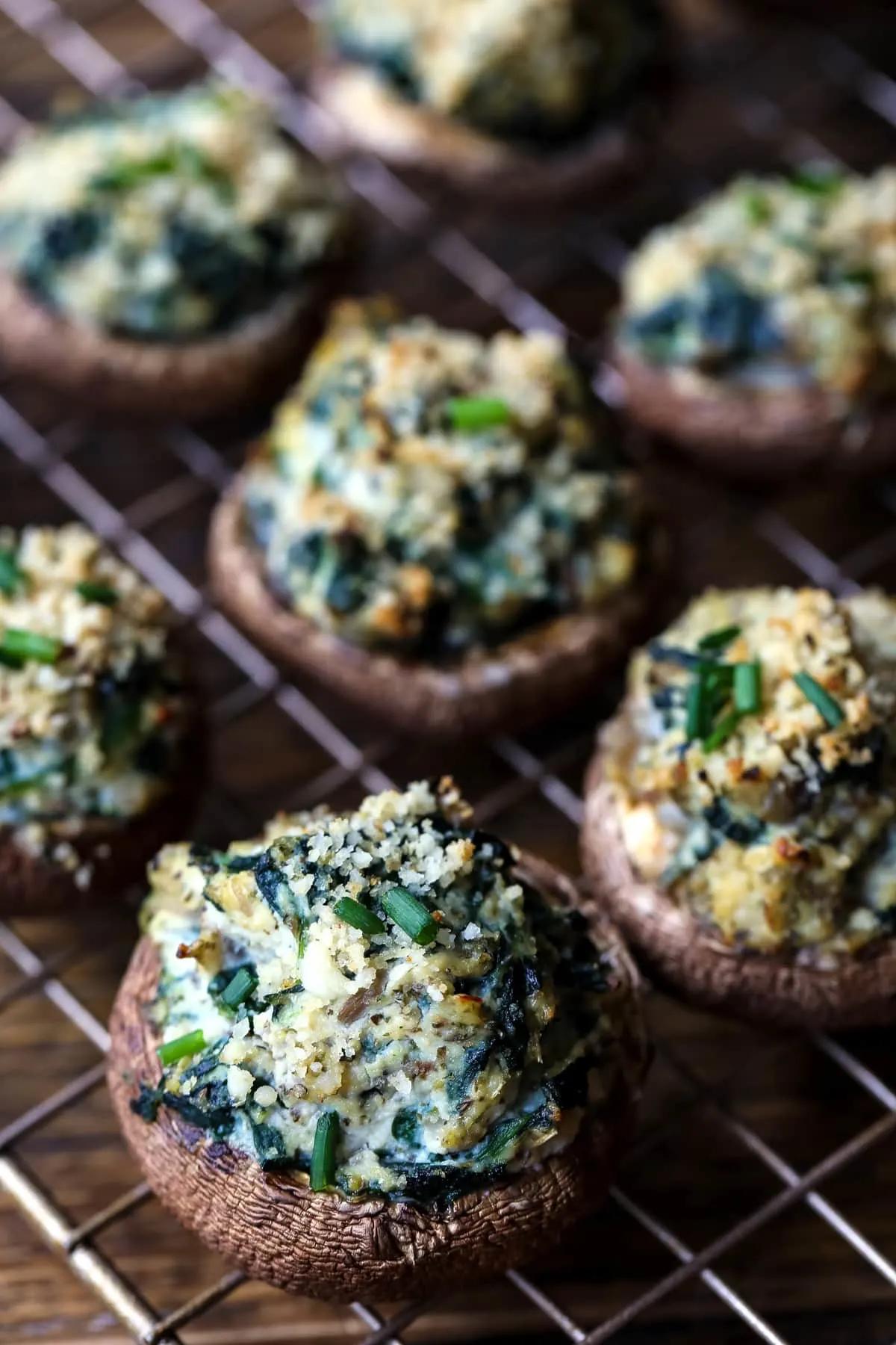 Stuffed mushrooms on a wire cooling rack. 