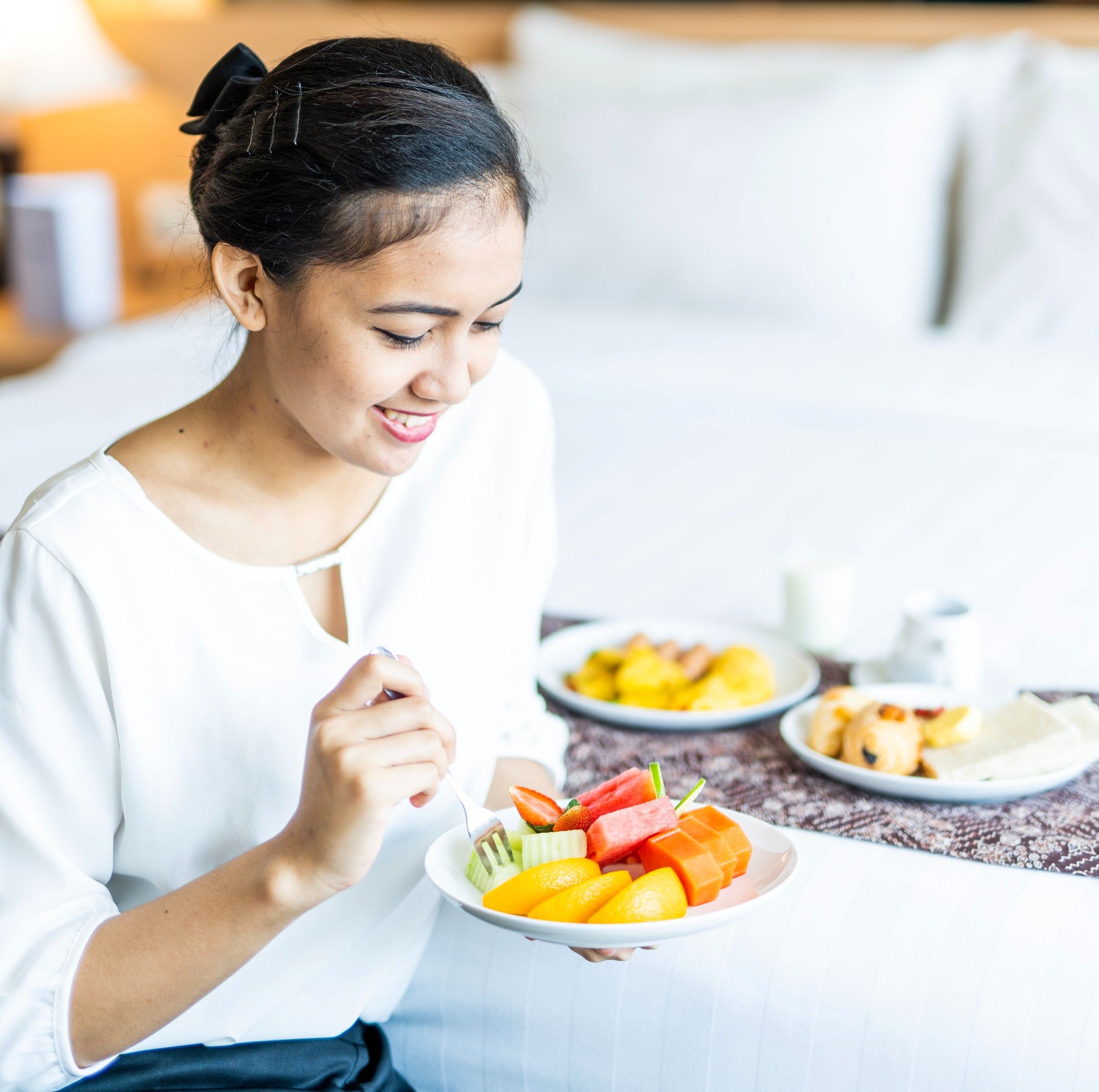 Woman eating fruits