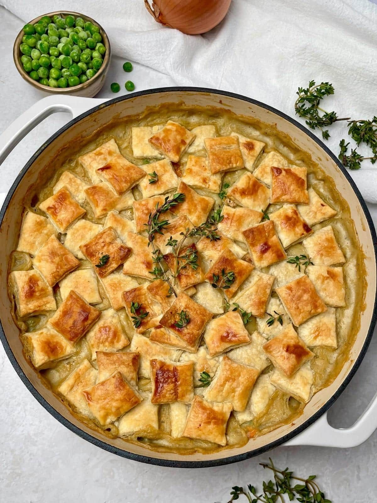 Vegan pot pie garnished with herbs.