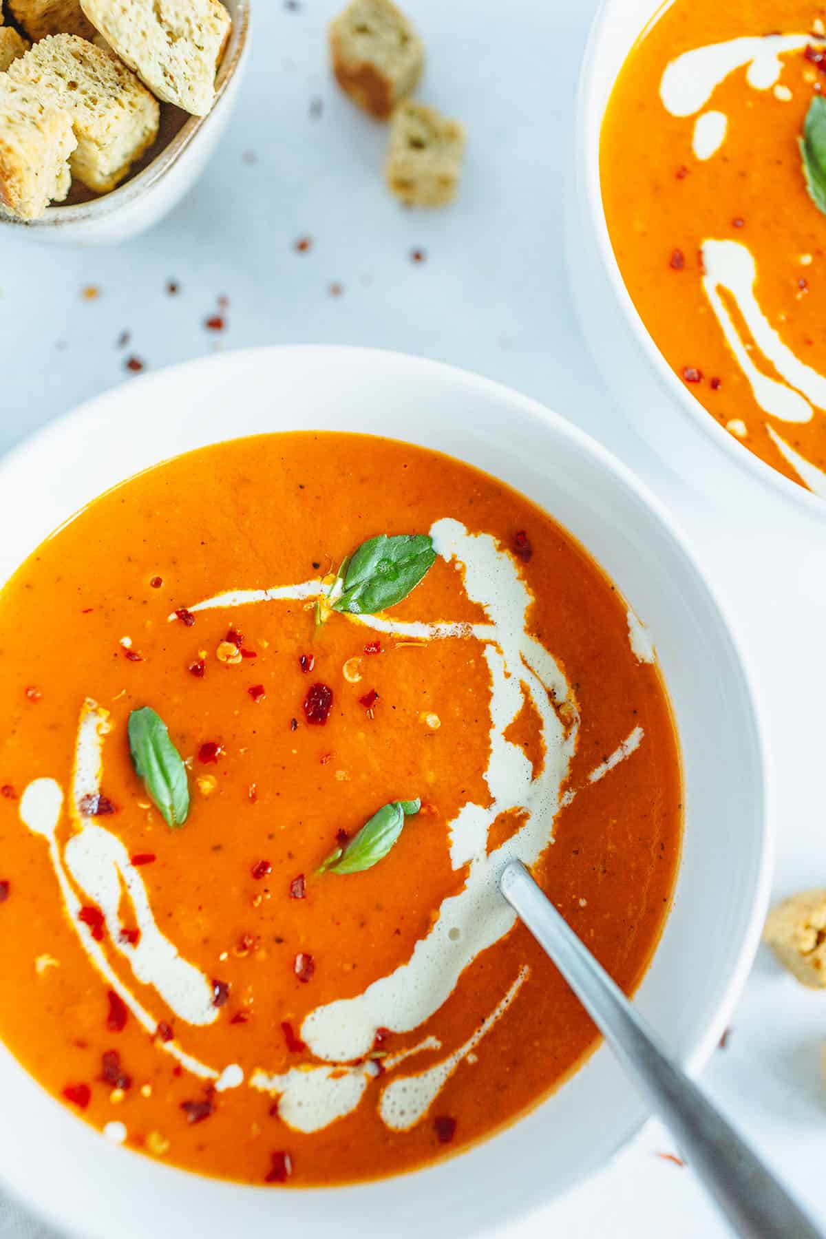 Two bowls of vegan roasted tomato soup.