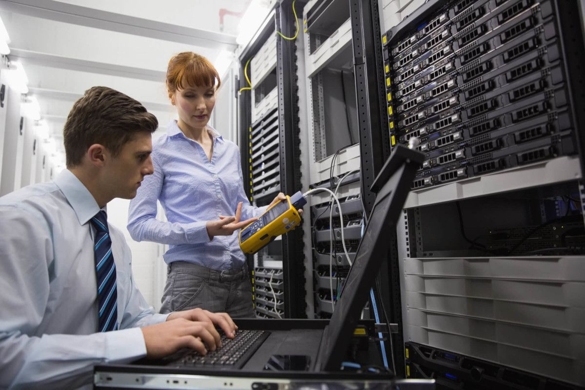 Man and woman working on data backup