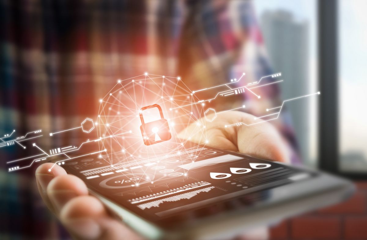 Man using mobile phone with digial cybersecurity padlock on it