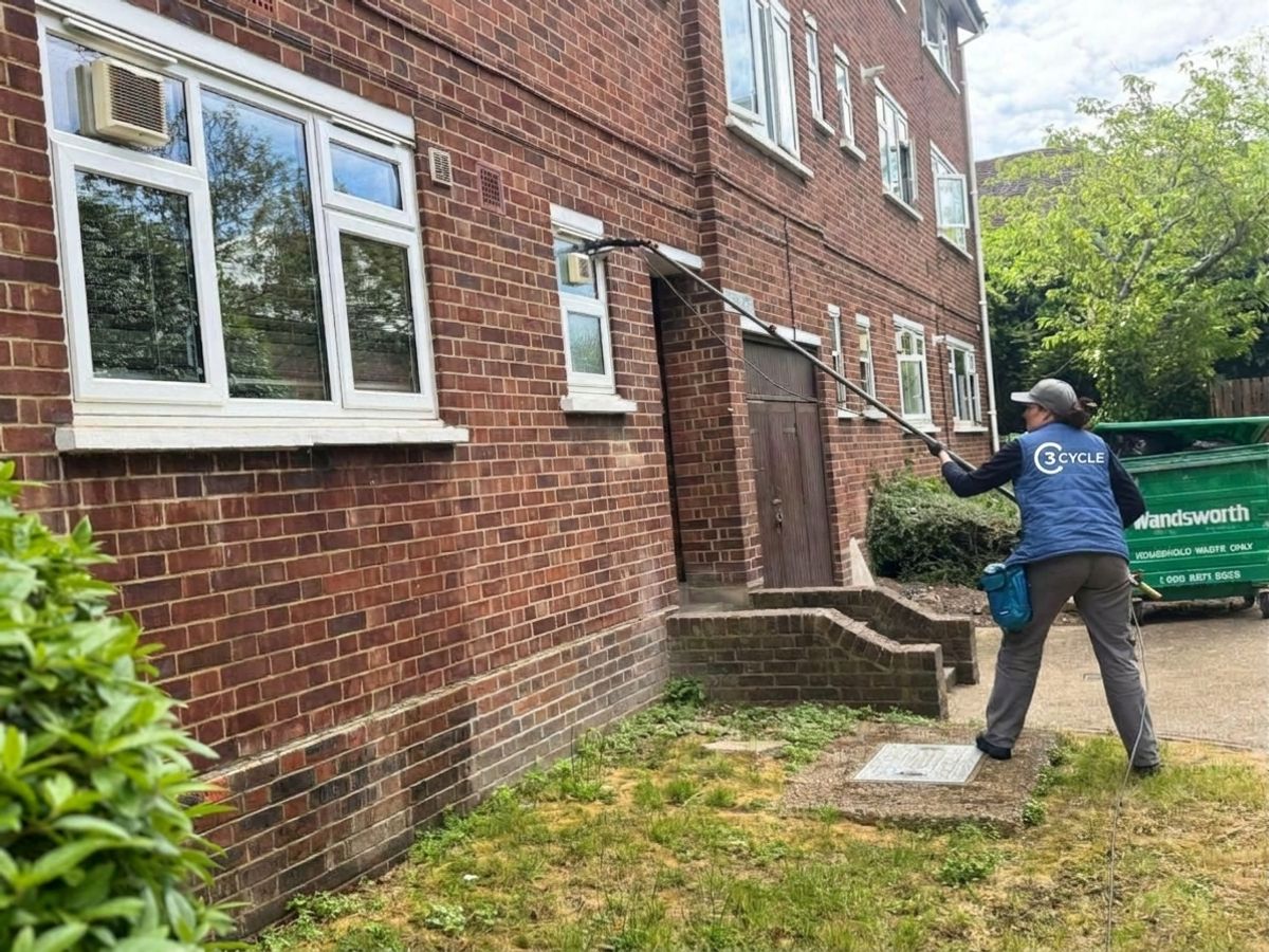 Woman cleaning a residential window