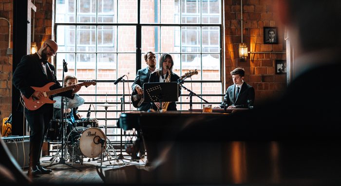JJ Band performing at a reception