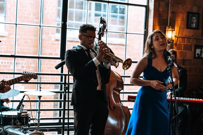 Vocalist and trumpet player performing