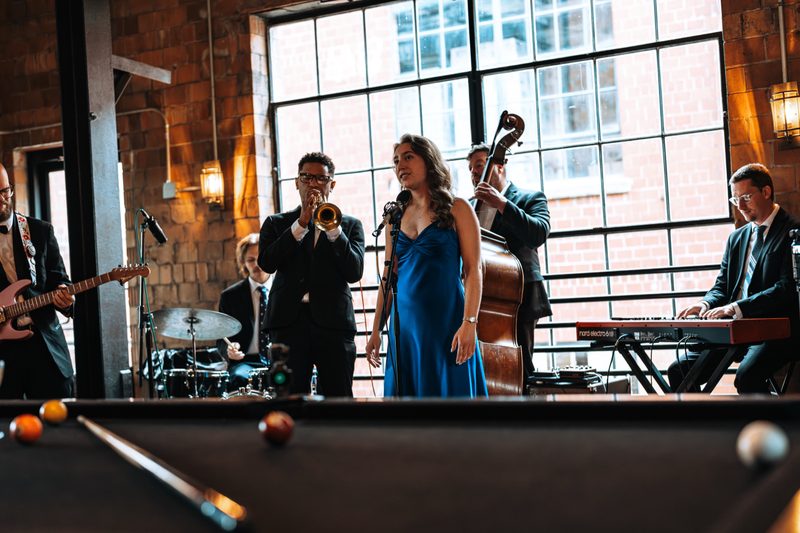 Full band with vocalist performing