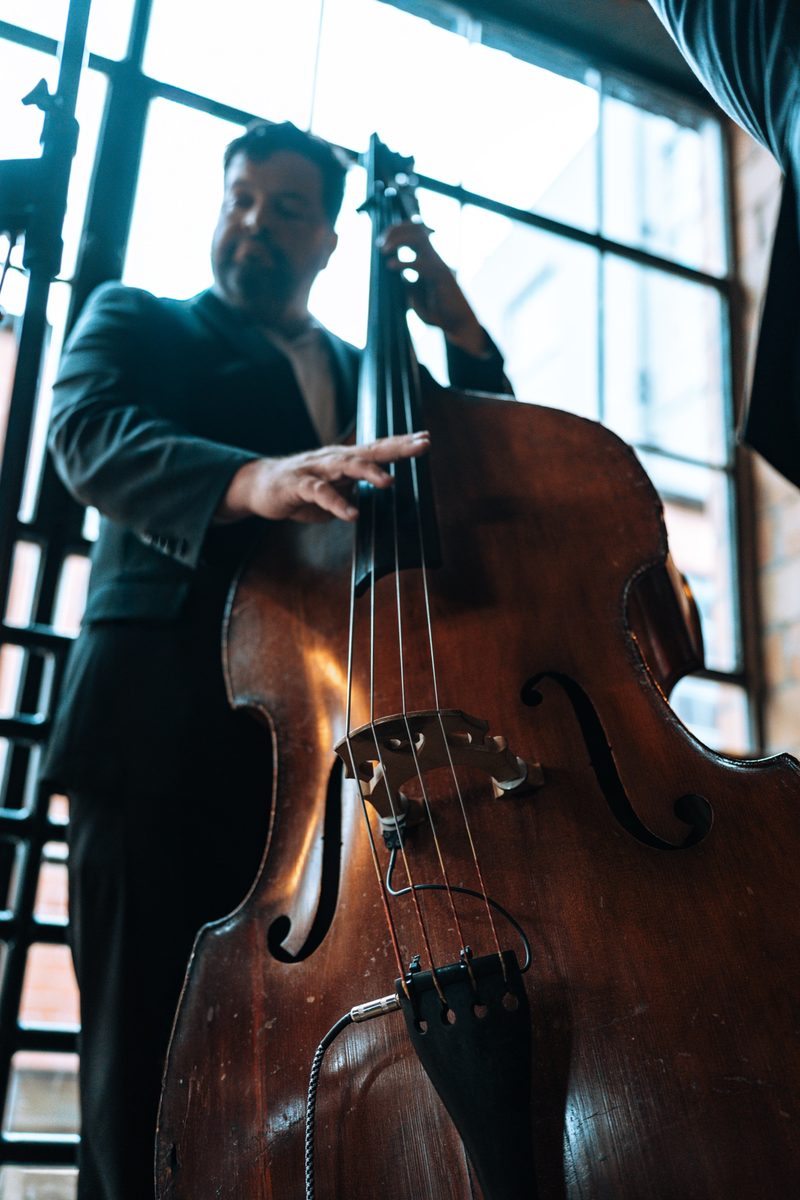 Upright bass player, low angle