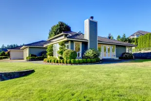 A large suburban home and front lawn.