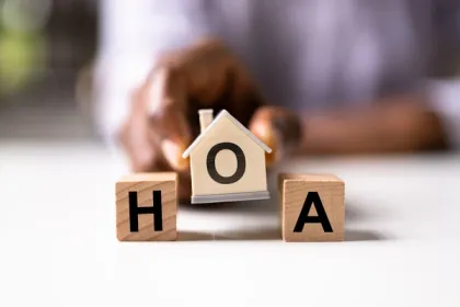 "HOA" lettered blocks shaped as blocks and a house in the center.