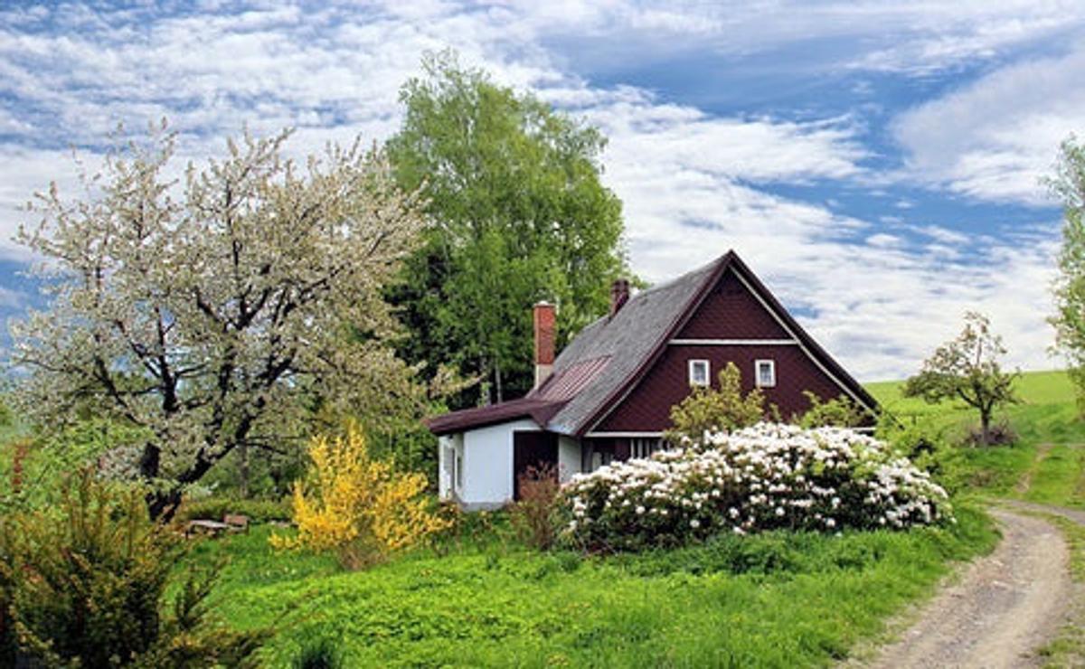 cottage with flowers and trees