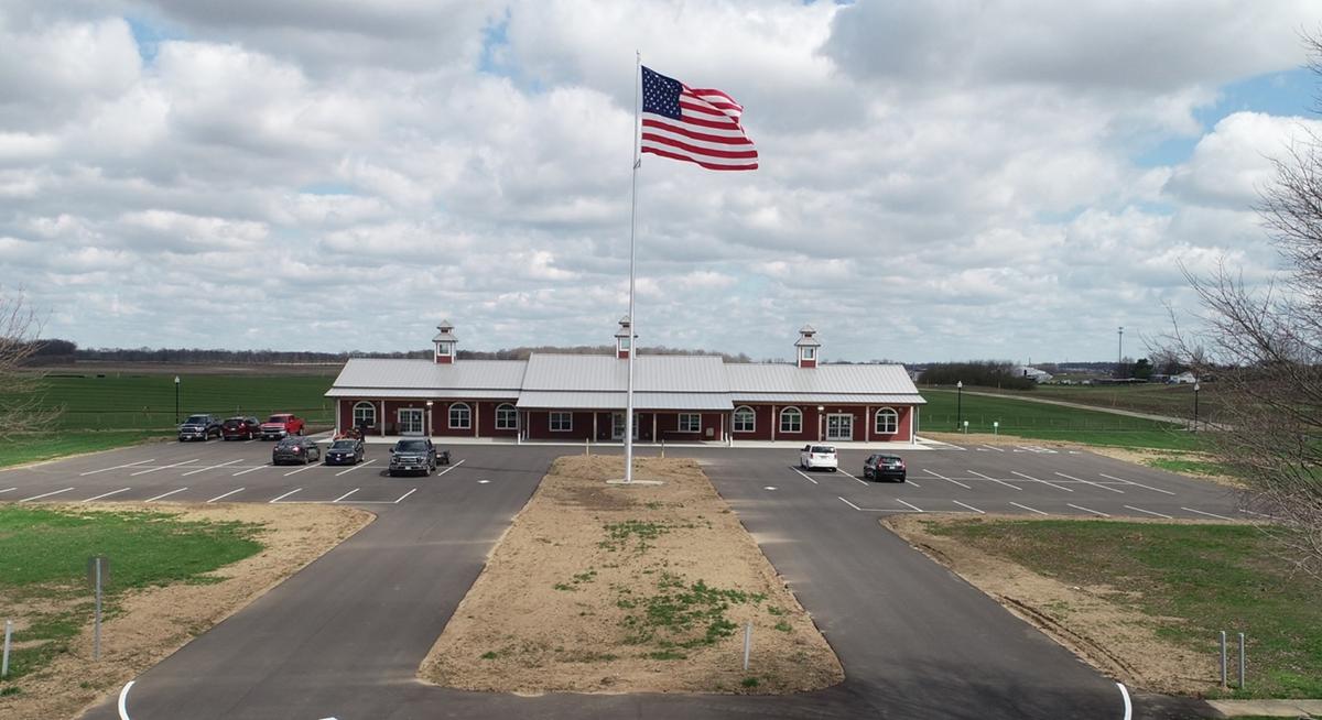 Exterior of a municipal building with a large section of grass