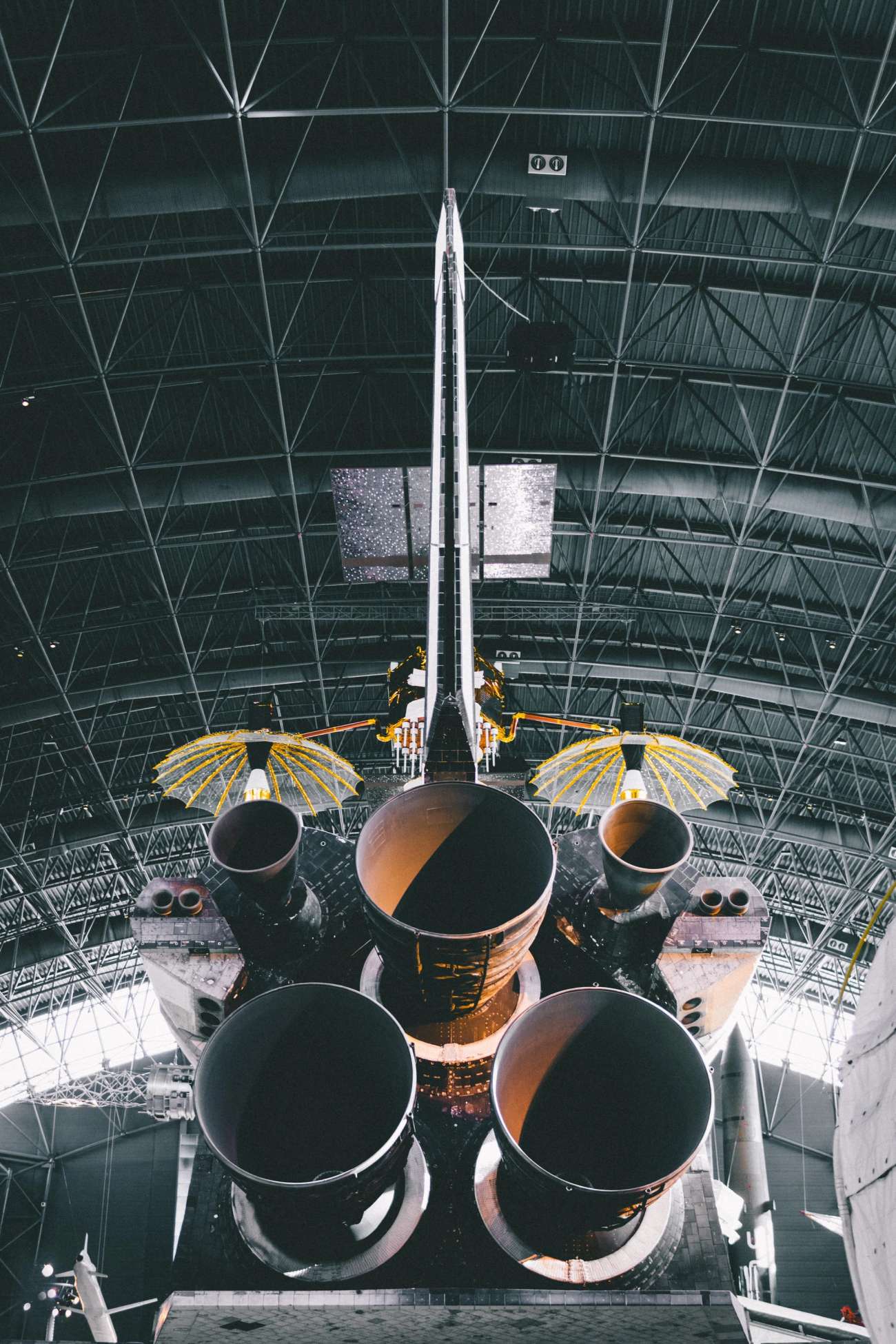 Space shuttle from behind in hangar