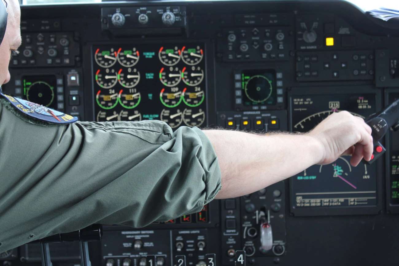 Person in uniform in airplane cockpit