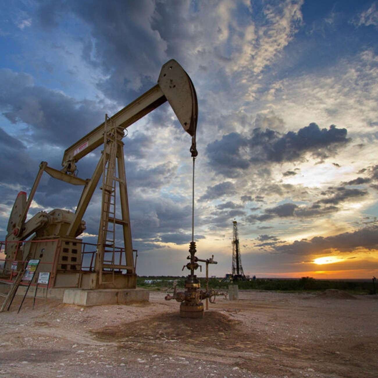 nodding donkey oil field at sunset