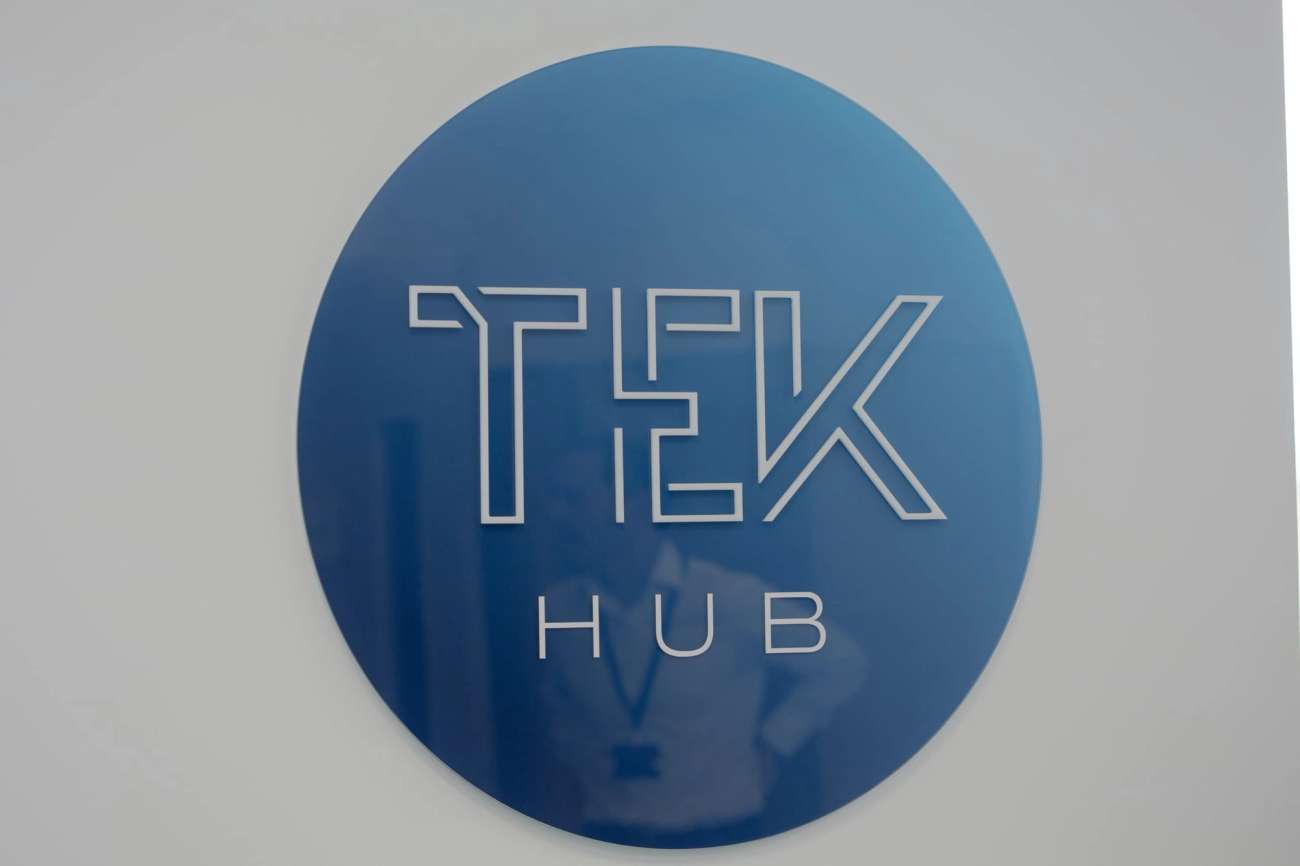 Circular Tek hub logo on wall