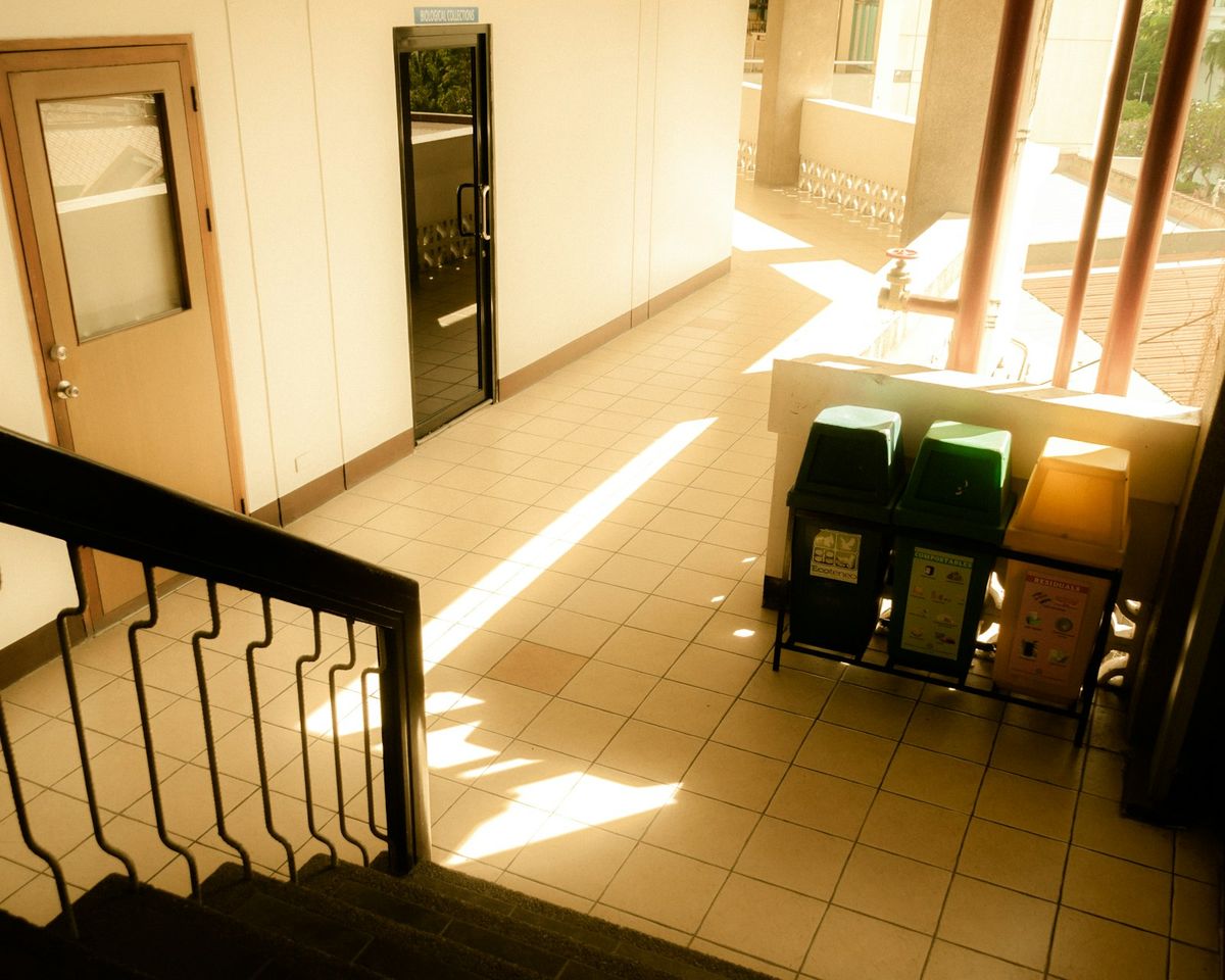 A well-maintained communal staircase in a managed apartment block