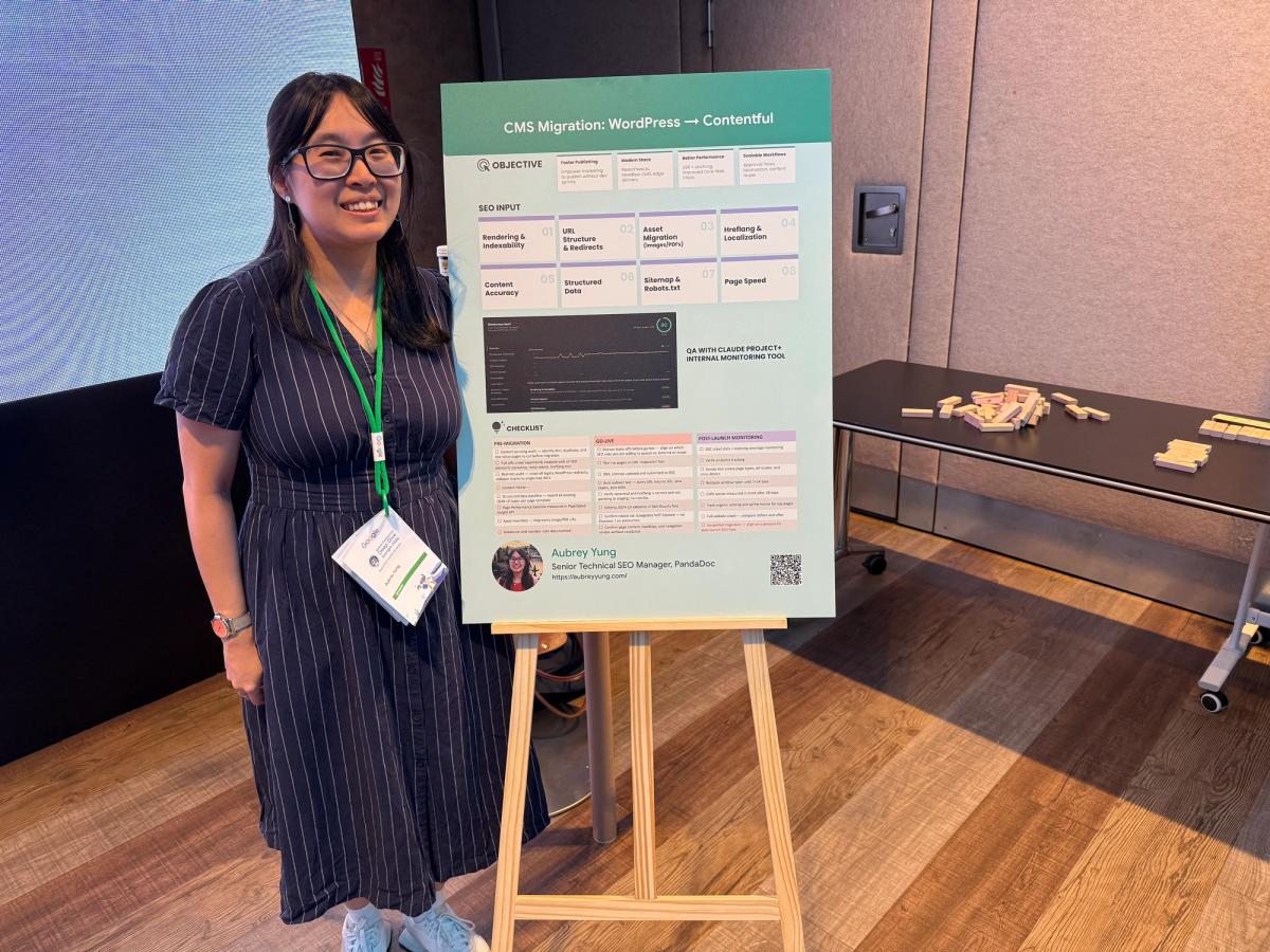 Aubrey Yung standing in front of a poster about CMS migration