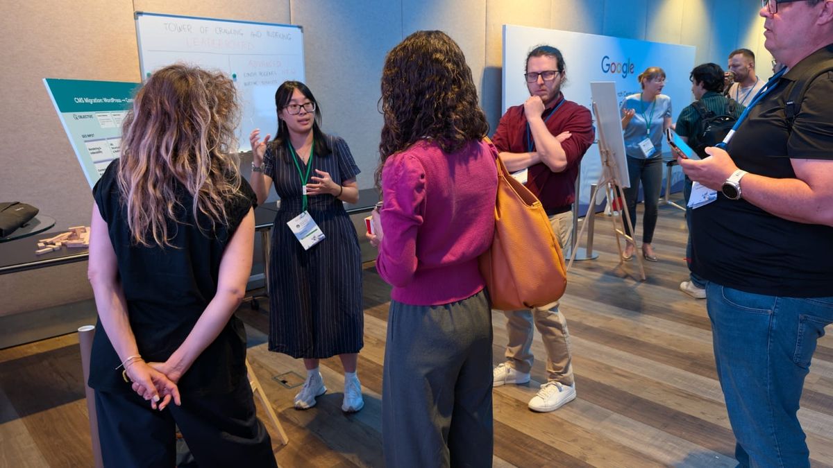 Aubrey Yung speaking in front of the poster at Google Search Central Live Deep Dive Europe 2026