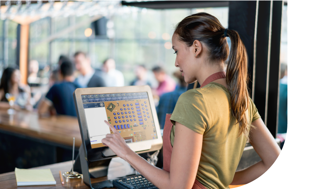woman using a POS system at restaurant